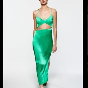 This dress is a backless maxi with an asymmetrical feature.